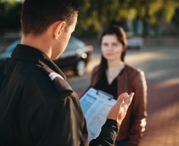 Police officers reads law to female driver